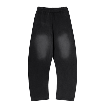 ODMPOD Sunfade Curved Blade fleece sweatpants showing a relaxed fit with curved design details and soft fleece fabric.