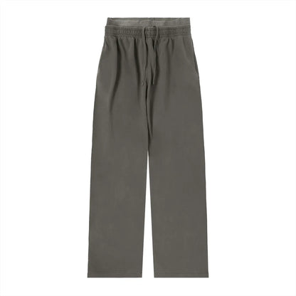 Vintage washed waist pants by ODMPOD featuring relaxed fit and faded denim texture, displayed on a neutral background.