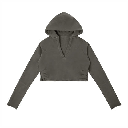 Vintage washed raw edge hoodie by ODMPOD featuring a distressed look and casual fit, shown in a relaxed front view.