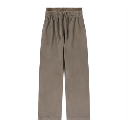 ODMPOD vintage washed waist pants with relaxed fit and distressed denim style, featuring belt loops and front pockets.