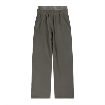 Vintage washed waist pants by ODMPOD featuring a relaxed fit and casual style, shown in a light, distressed denim fabric.