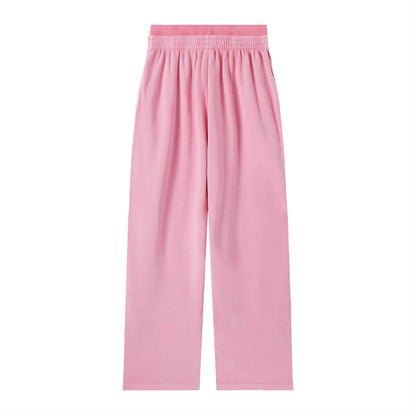 Vintage washed waist pants by ODMPOD featuring a relaxed fit and faded denim look on a model.