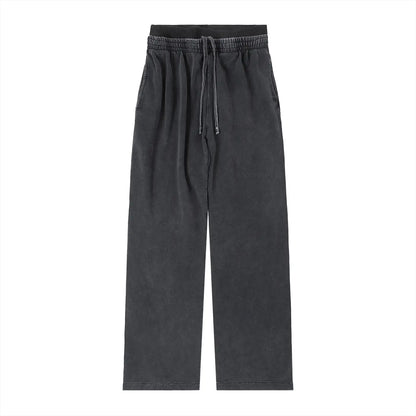ODMPOD vintage washed waist pants showing relaxed fit and faded denim fabric with belt loops and front pockets.