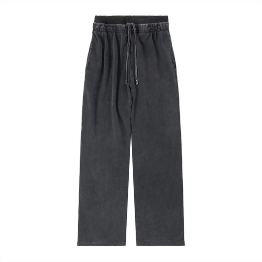 ODMPOD vintage washed waist pants showing relaxed fit and faded denim fabric with belt loops and front pockets.