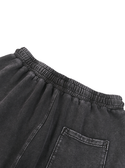 ODMPOD snow washed straight leg pants displayed on a hanger with a relaxed fit and casual style.