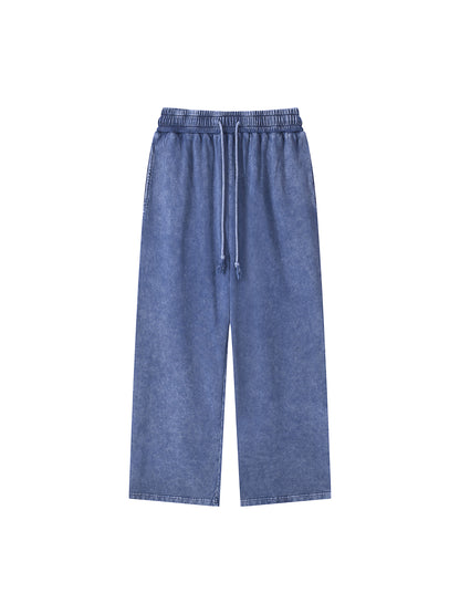 ODMPOD snow washed straight leg pants displayed on a model, showcasing the relaxed fit and casual denim style.