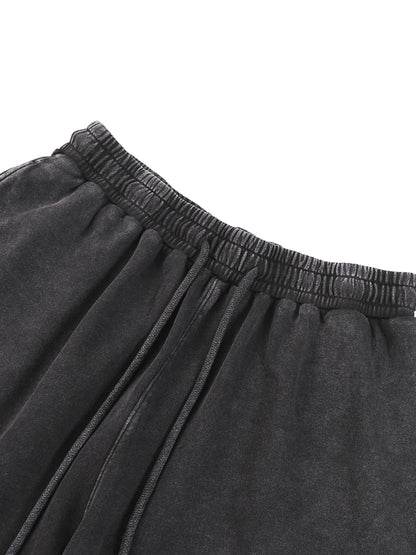 ODMPOD snow washed straight leg pants shown on a model, featuring a relaxed fit and casual style for everyday wear.