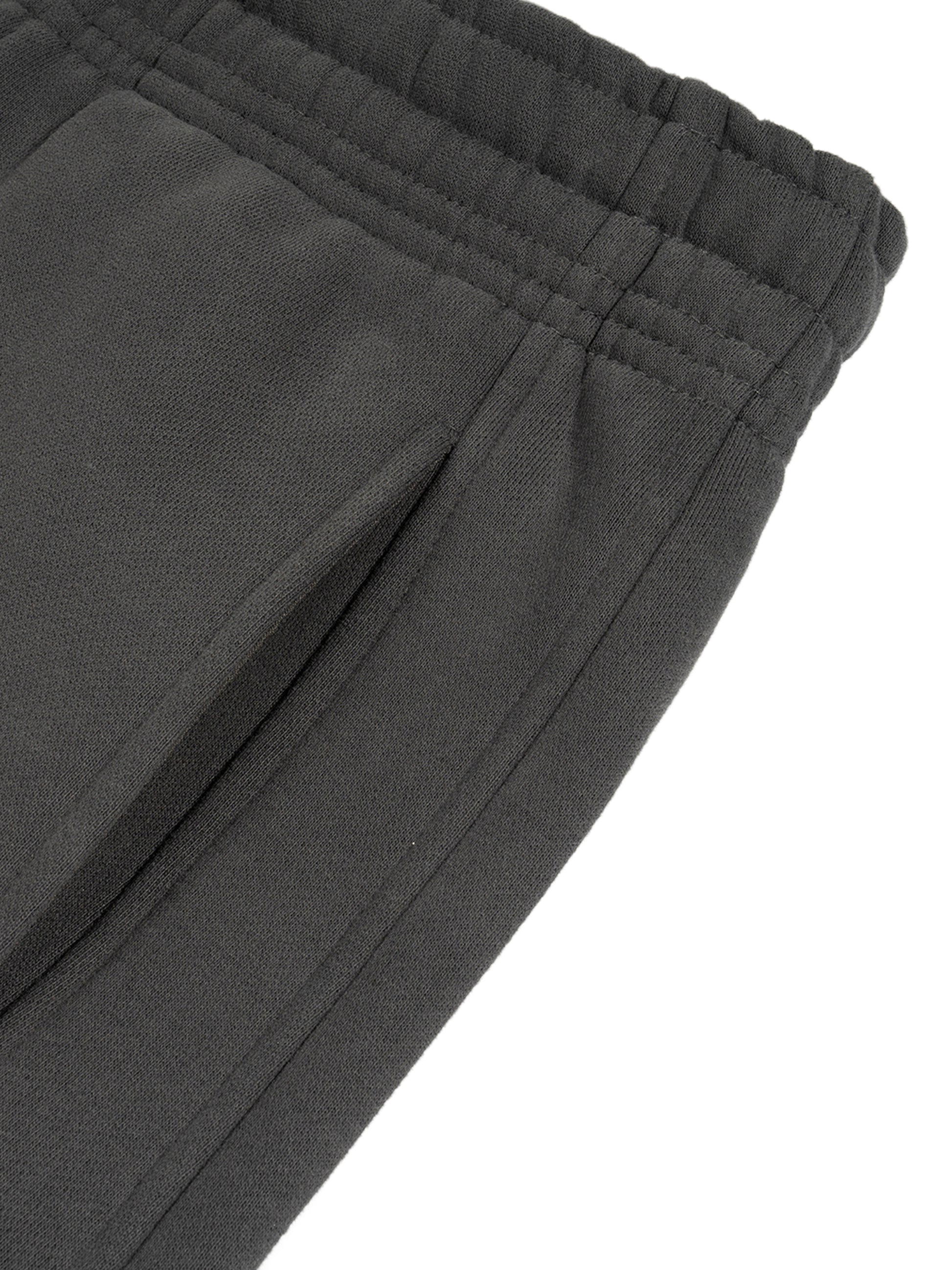 ODMPOD Sunfade Curved Blade fleece sweatpants showing relaxed fit and soft fabric with curved waistband design.
