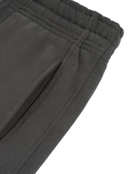 ODMPOD Sunfade Curved Blade fleece sweatpants showing relaxed fit and soft fabric with curved waistband design.