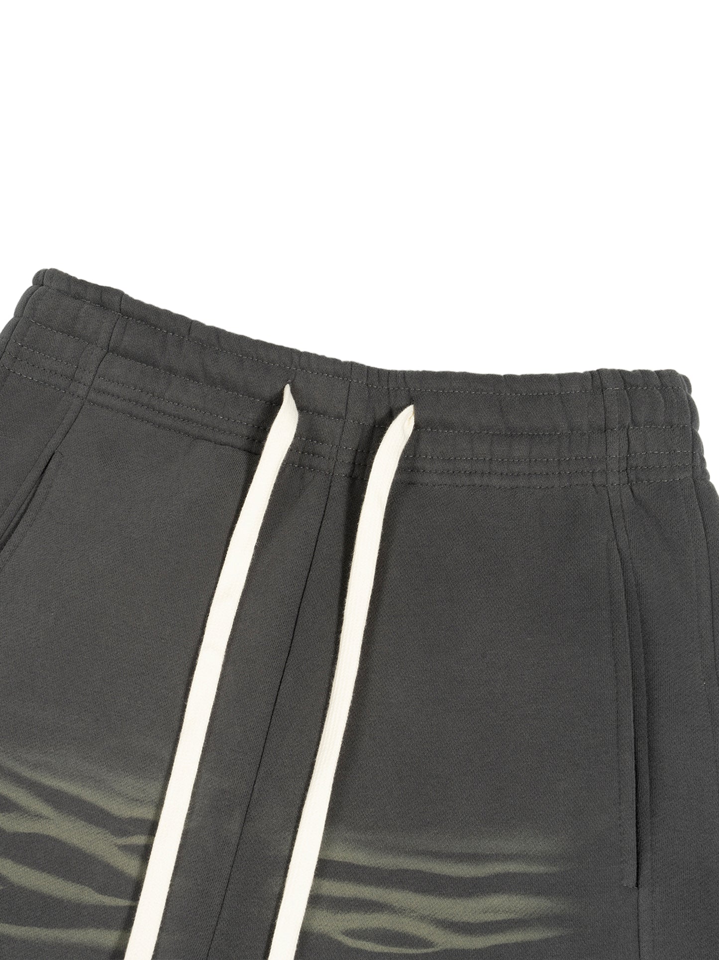 ODMPOD Sunfade Curved Blade fleece sweatpants showing the relaxed fit and curved hem in soft, comfortable fabric.