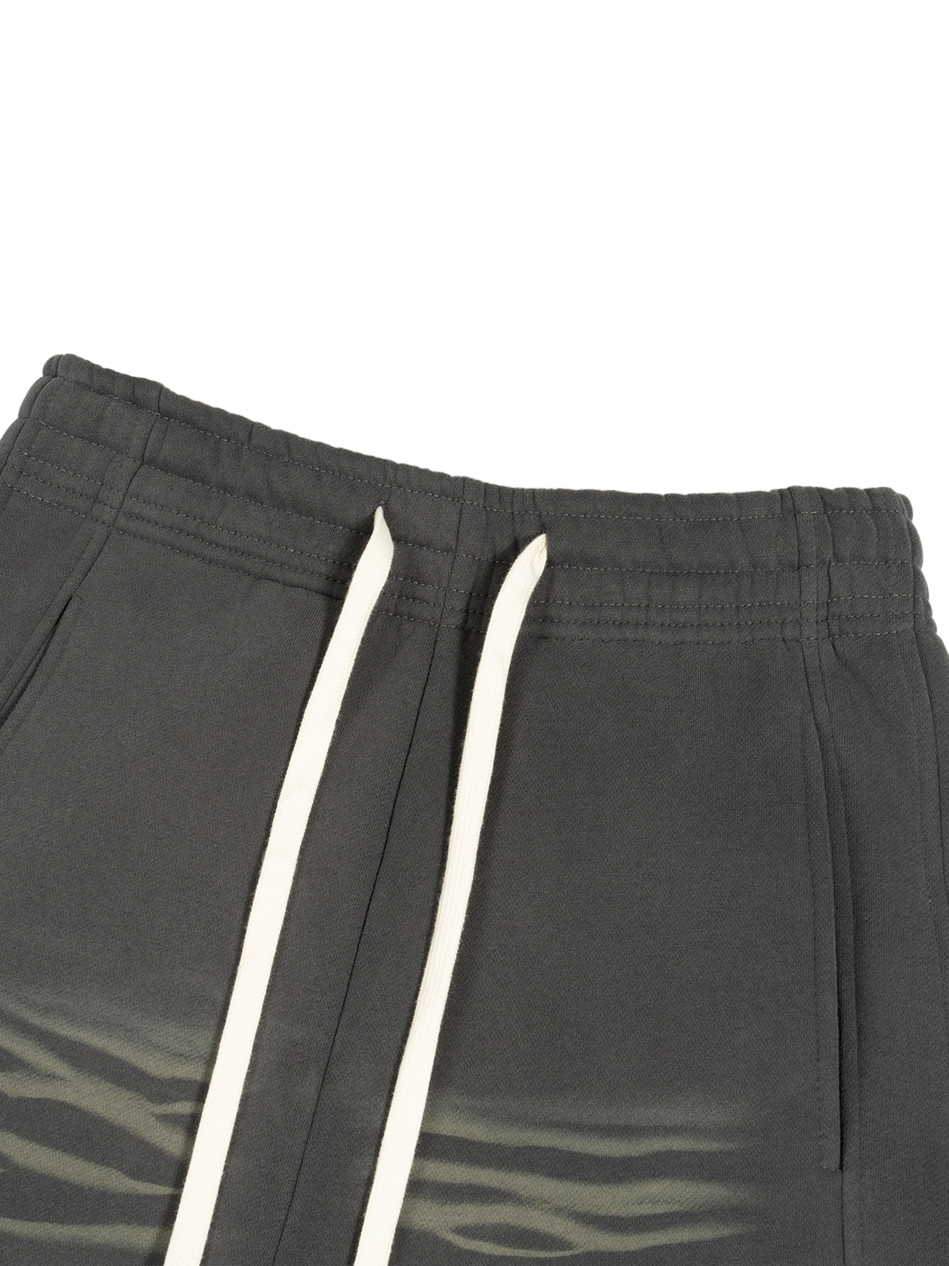 ODMPOD Sunfade Curved Blade fleece sweatpants showing the relaxed fit and curved hem in soft, comfortable fabric.