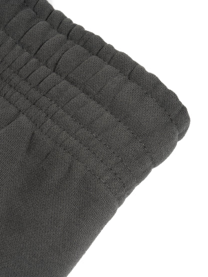 ODMPOD Sunfade Curved Blade fleece sweatpants showing a relaxed fit and curved hem in soft fleece fabric