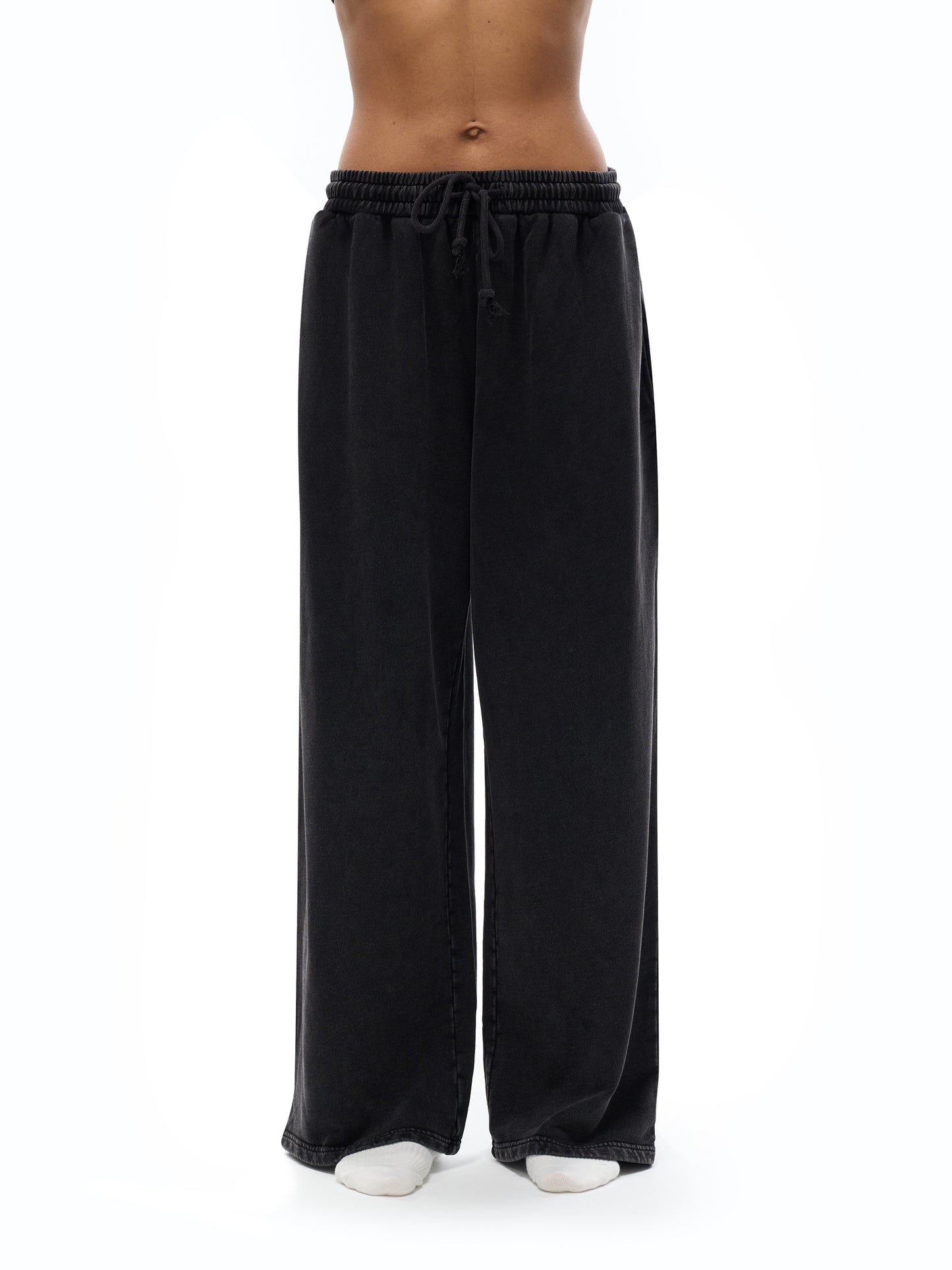 ODMPOD snow washed straight leg pants shown on a model, featuring a relaxed fit and casual style in a neutral color.