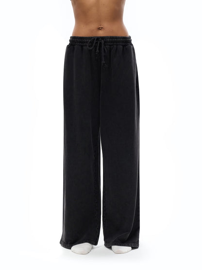 ODMPOD snow washed straight leg pants shown on a model, featuring a relaxed fit and casual style in a neutral color.