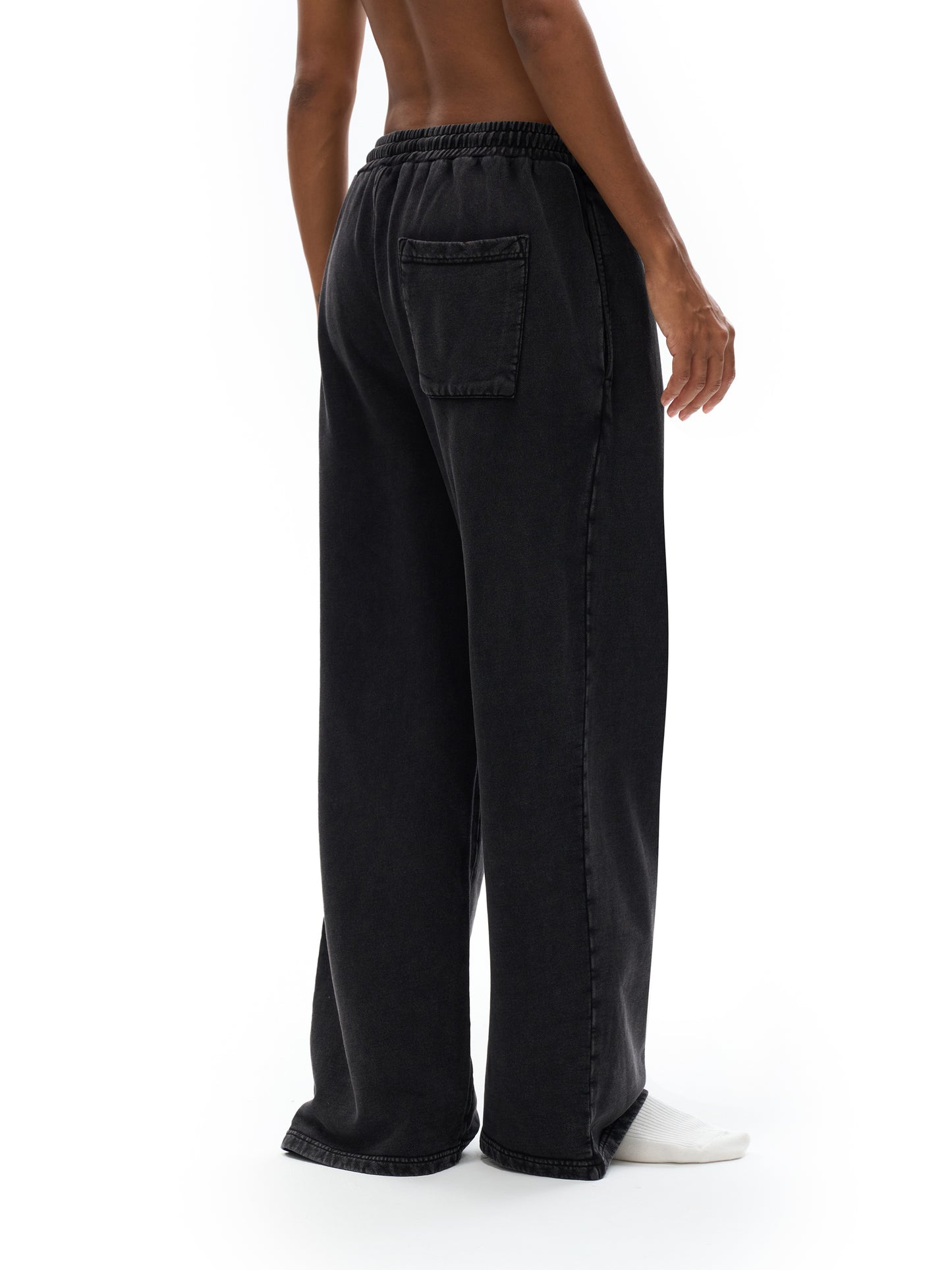 ODMPOD snow washed straight leg pants displayed on a model, showcasing relaxed fit and casual style.