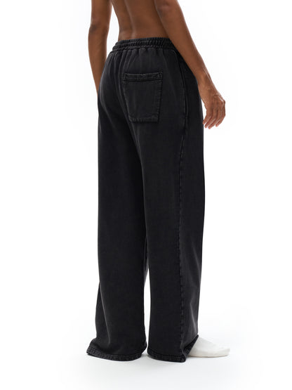 ODMPOD snow washed straight leg pants displayed on a model, showcasing relaxed fit and casual style.