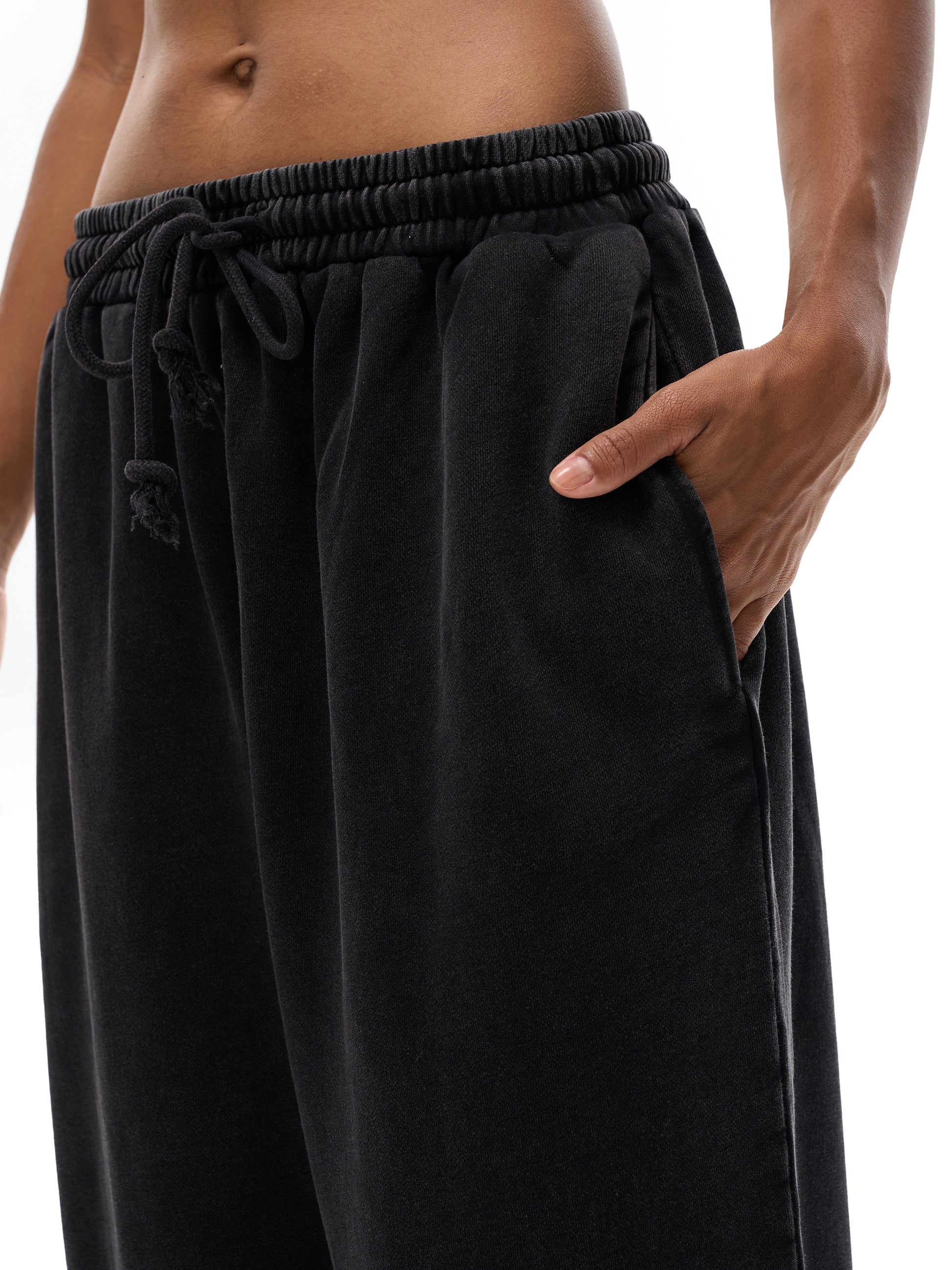 ODMPOD snow washed straight leg pants, light blue denim with a relaxed fit, displayed on a hanger against a neutral background.