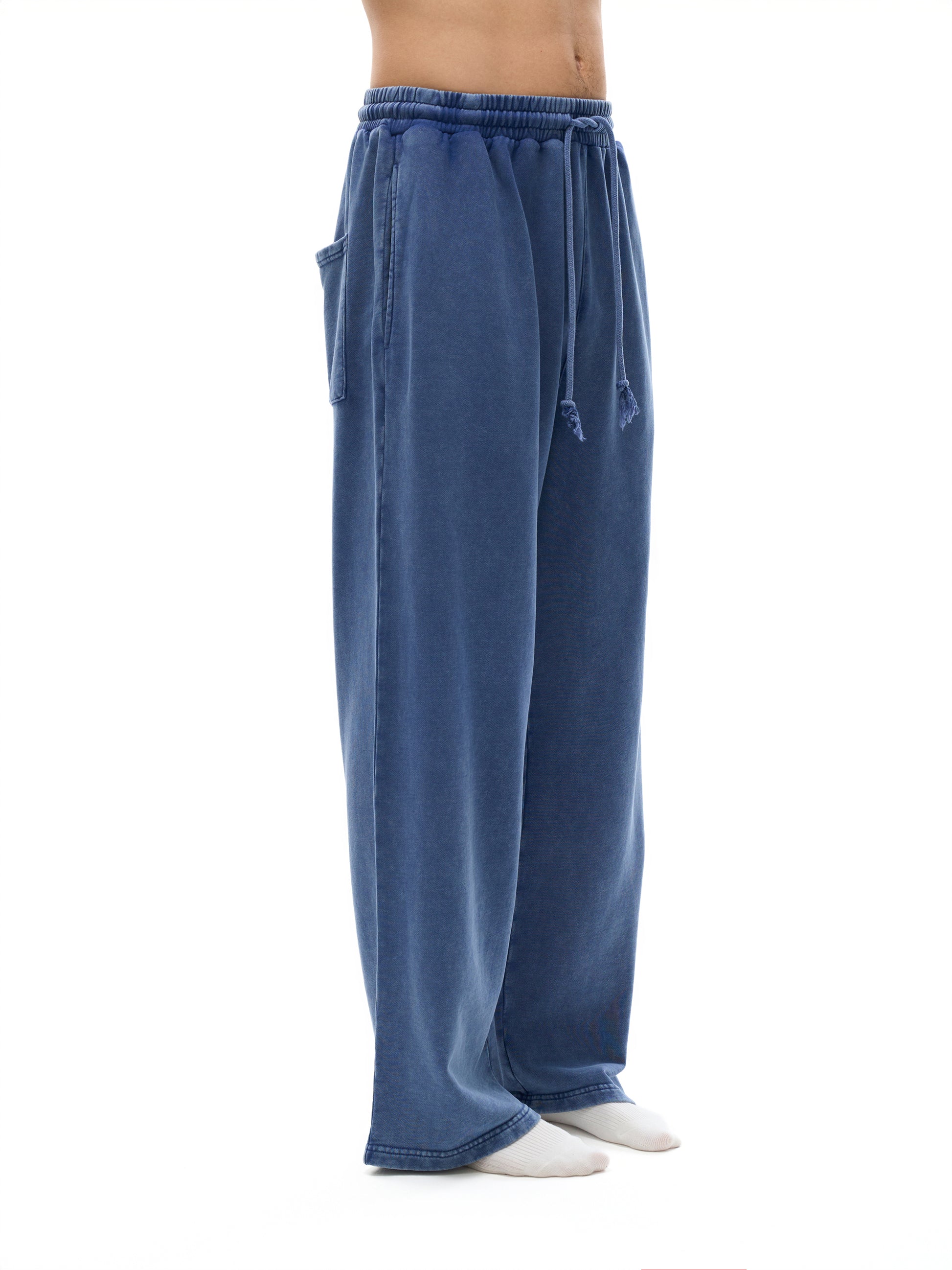 ODMPOD Snow Washed Straight Leg Pants displayed on a model, showcasing casual fit and distressed denim texture.