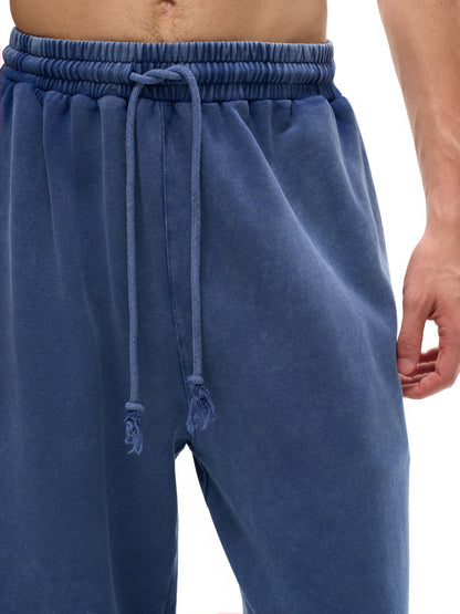 ODMPOD snow washed straight leg pants shown in natural light with a relaxed fit and casual style.