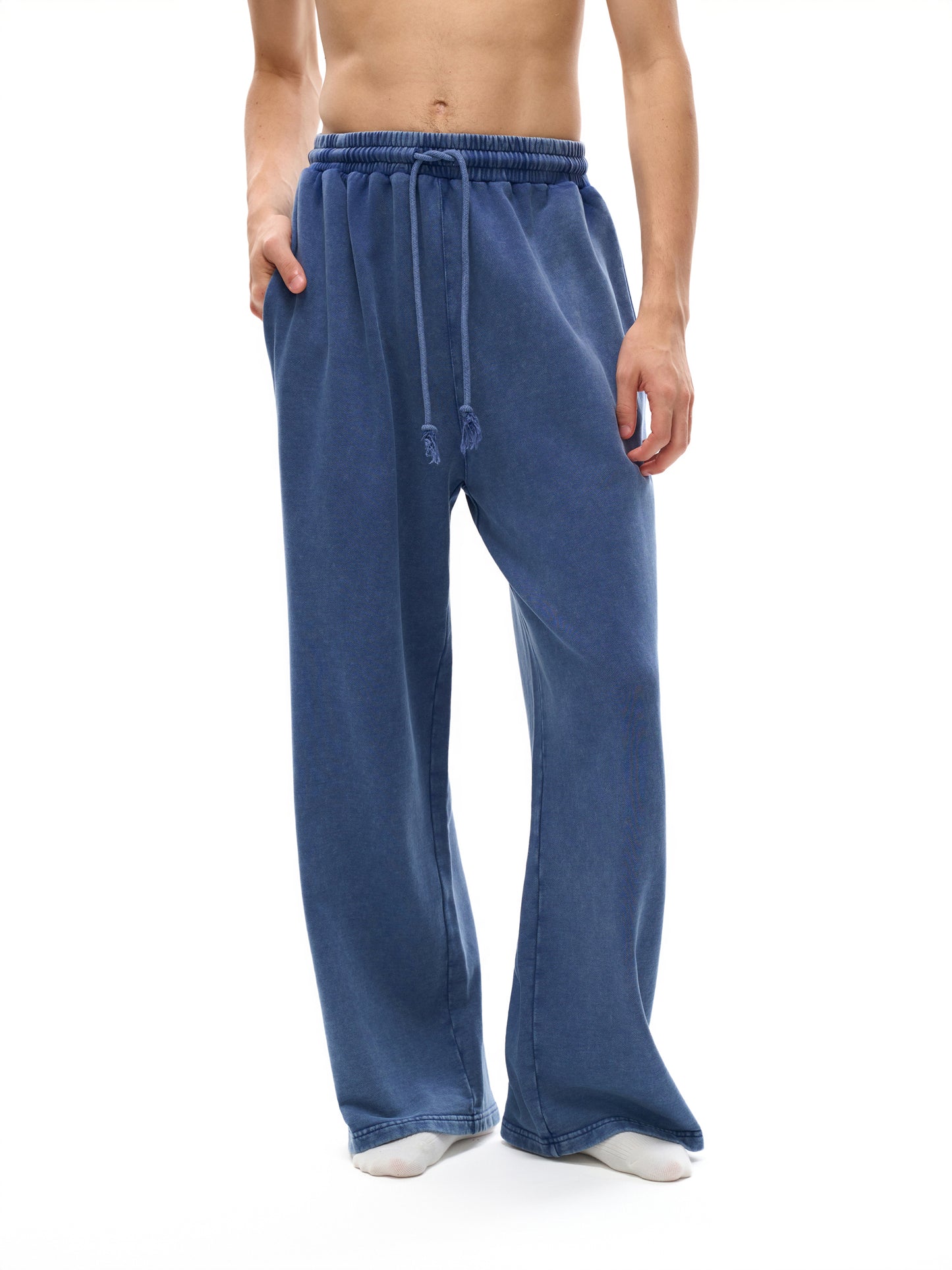 Snow Washed Straight Leg Pants by ODMPOD, featuring a relaxed fit in soft, faded denim fabric, displayed on a hanger.