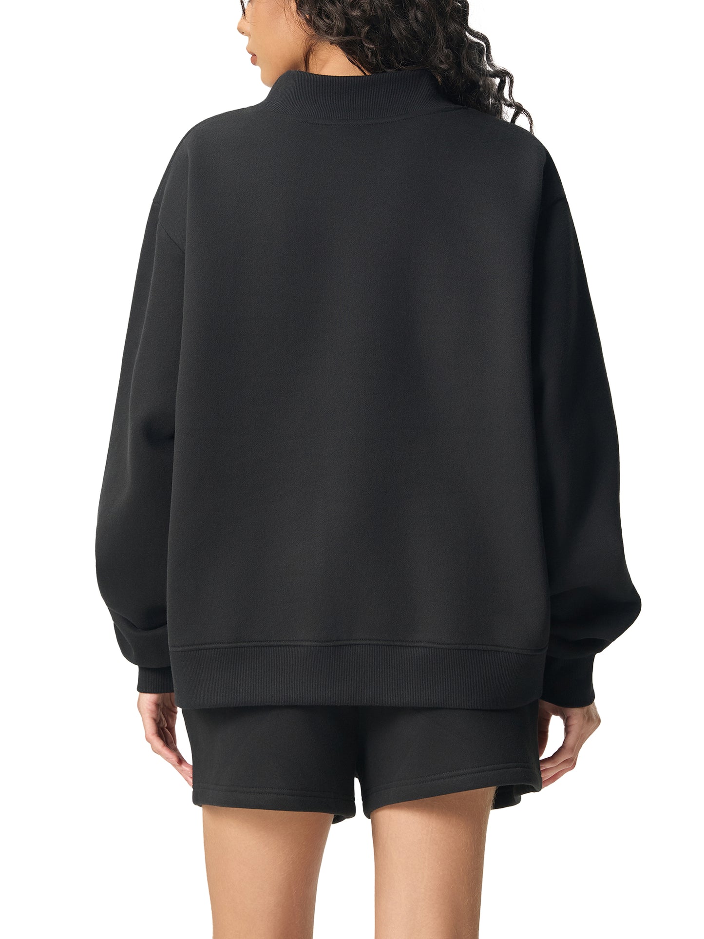 ODMPOD essential fleece mock-neck crew sweatshirt in soft, cozy fabric, shown in a close-up view highlighting the neckline and texture.