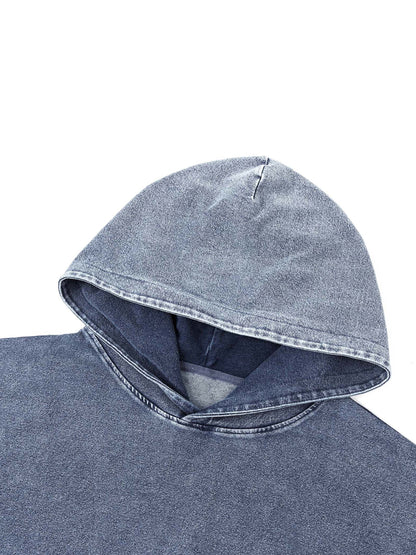 ODMPOD Snow Wash oversized hoodie in light grey with a relaxed fit, showcasing soft fabric and casual style.