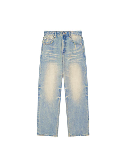ODMPOD Sun Fade Raw Hem Denim Jeans showing distressed denim with sun-faded wash and raw hem detail.