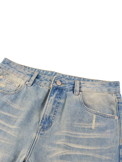 ODMPOD Sun Fade Raw Hem Denim Jeans showing faded blue raw denim with distressed hems and classic fit.