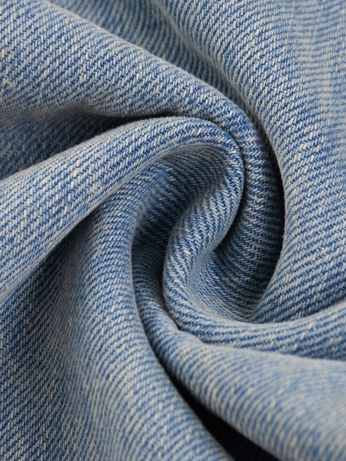 ODMPOD Sun Fade Raw Hem Denim Jeans with distressed finish and faded sun-kissed look, showcasing raw hem detail and classic denim texture.