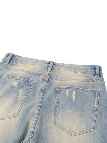ODMPOD Sun Fade Raw Hem Denim Jeans, close-up of distressed light-wash denim with raw hem detail and faded sun-inspired design.