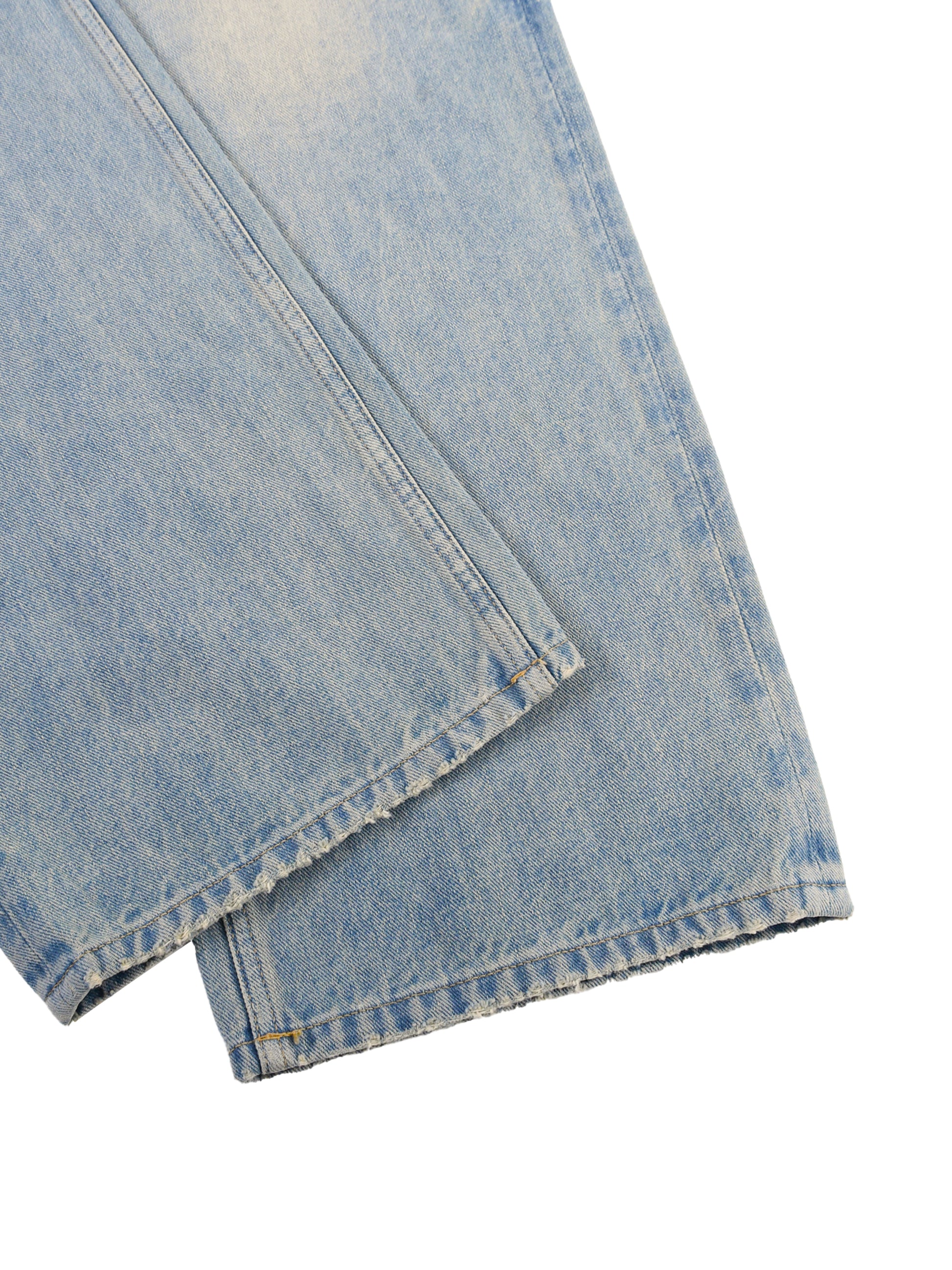 ODMPOD Sun Fade Raw Hem Denim Jeans showing distressed raw hem details and sun fade effect on classic blue denim.