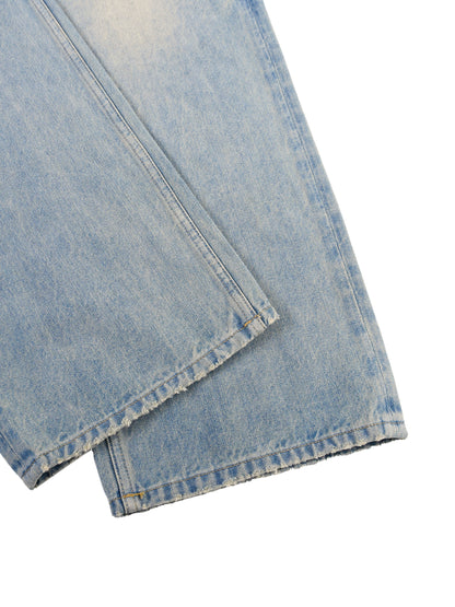 ODMPOD Sun Fade Raw Hem Denim Jeans showing distressed raw hem details and sun fade effect on classic blue denim.