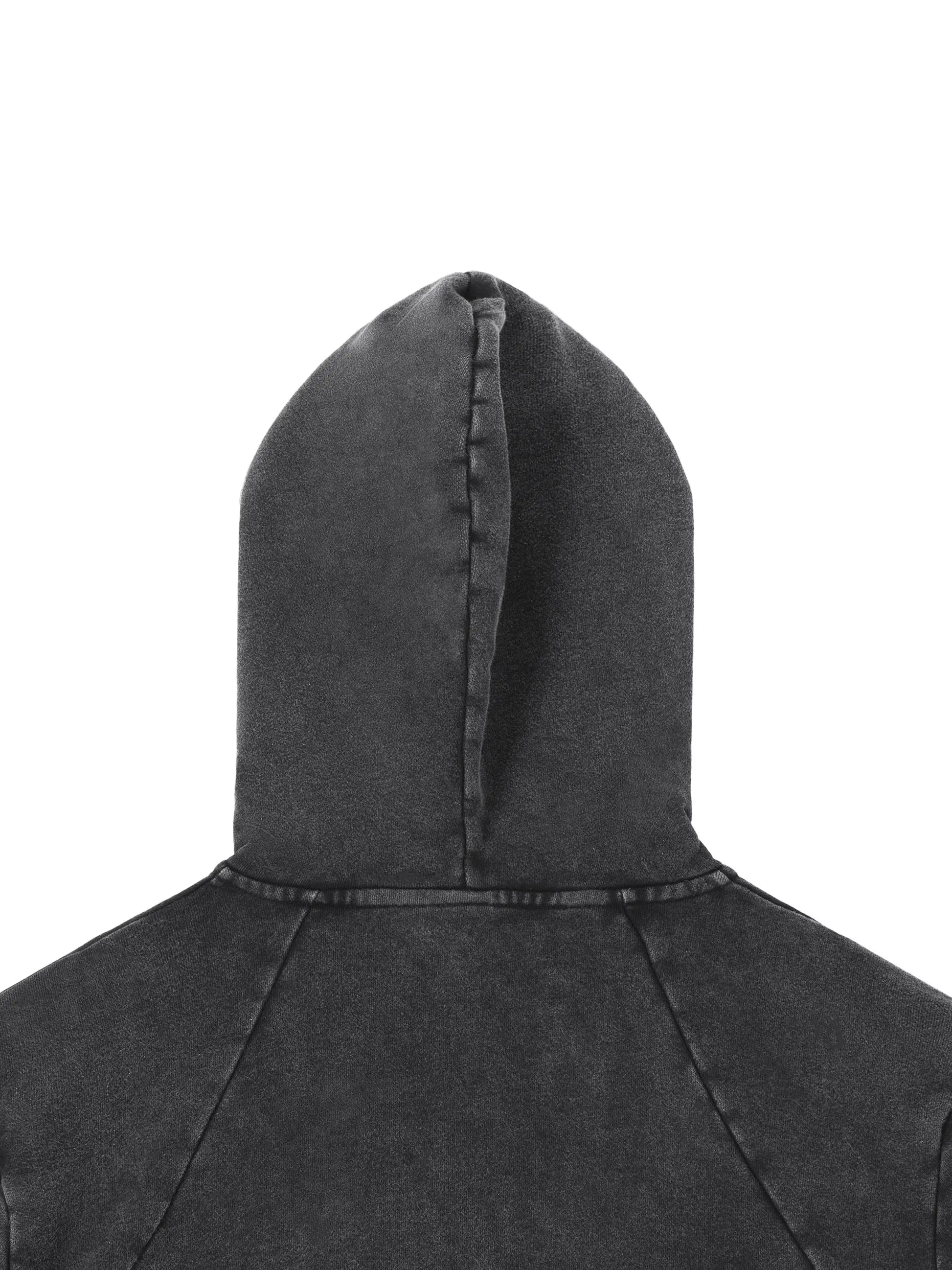 Vintage Washed Raw Edge Hoodie by ODMPOD, showing the distressed hem and soft fabric in a casual fit.