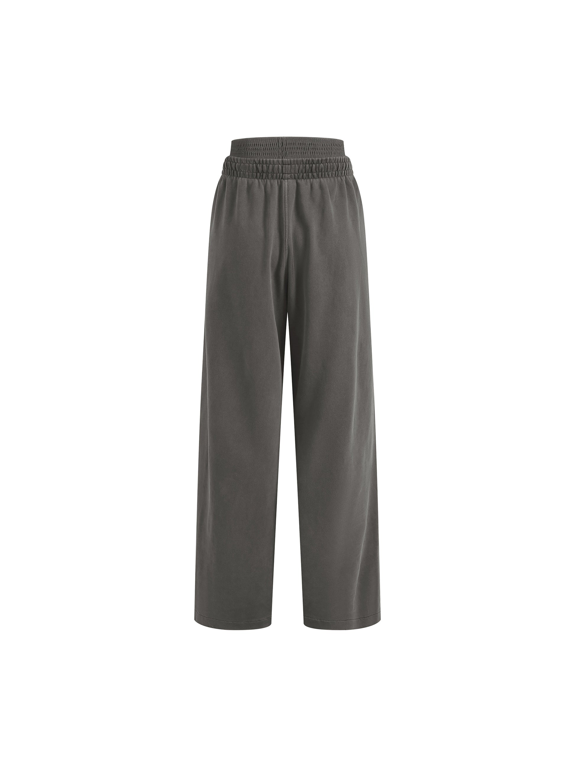 ODMPOD vintage washed waist pants shown on a model, featuring relaxed fit and casual style with distressed details.