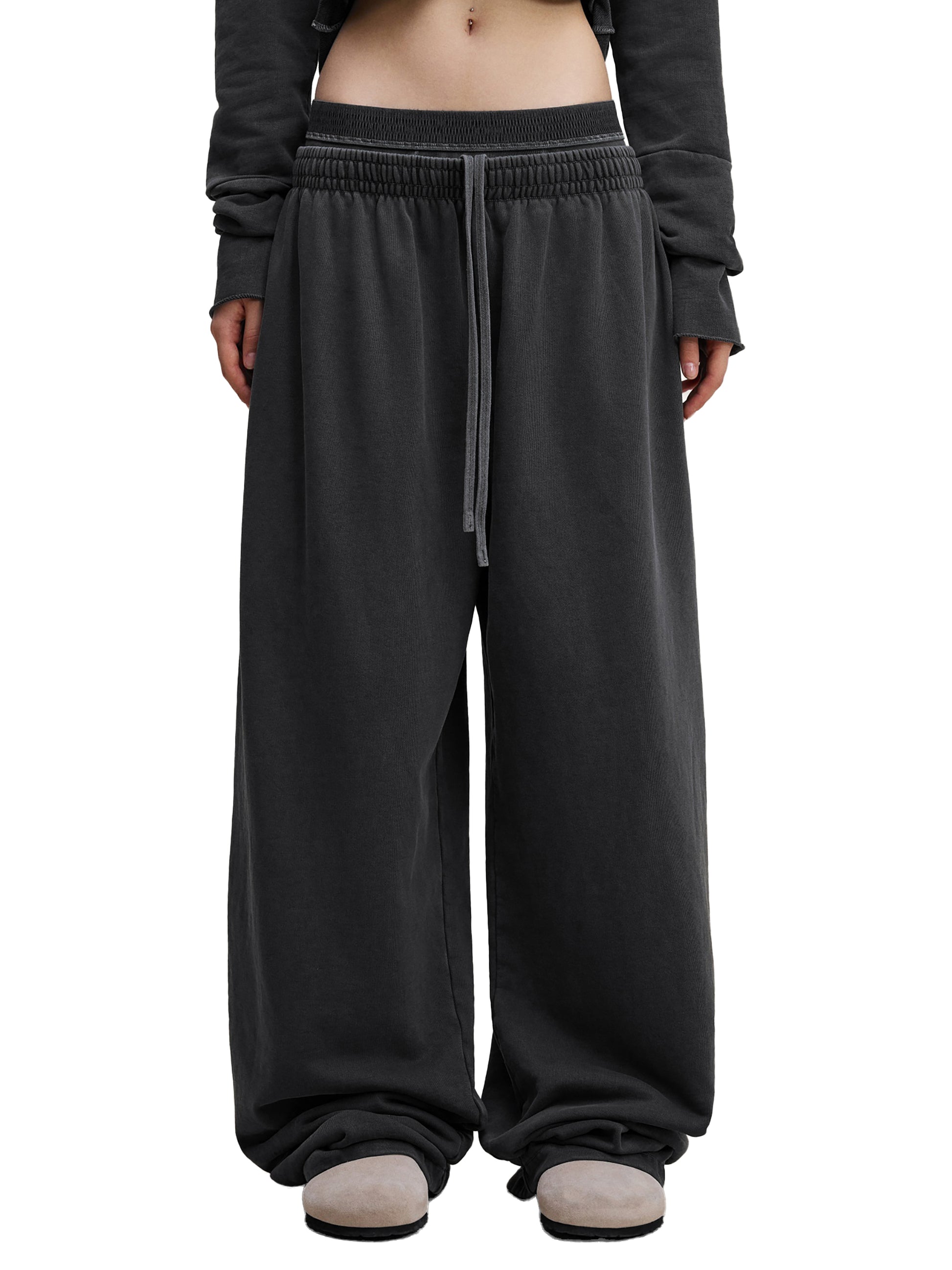 ODMPOD vintage washed waist pants with relaxed fit, featuring faded denim texture and classic waistline design.