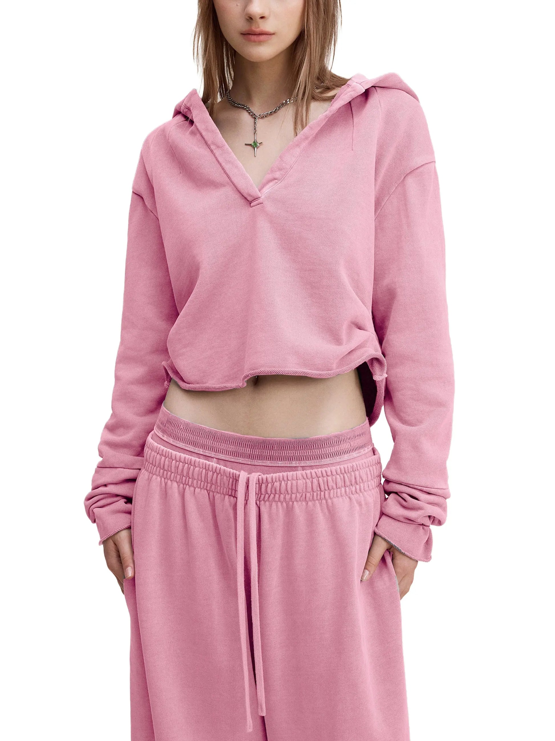 Vintage washed raw edge hoodie by ODMPOD featuring distressed fabric and casual fit, displayed on a plain background.
