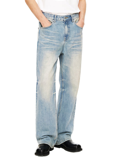 ODMPOD Sun Fade Raw Hem Denim Jeans showing distressed raw hem and faded sun-washed denim fabric.