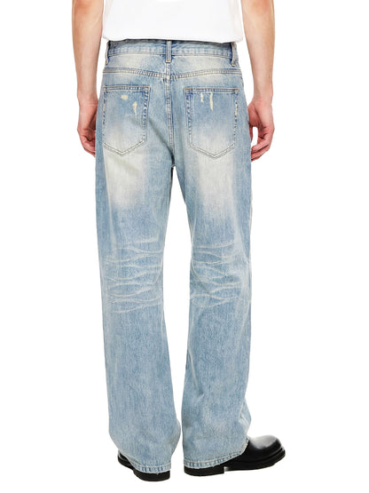 ODMPOD Sun Fade Raw Hem Denim Jeans showing distressed raw hem and faded sun-bleached denim fabric.