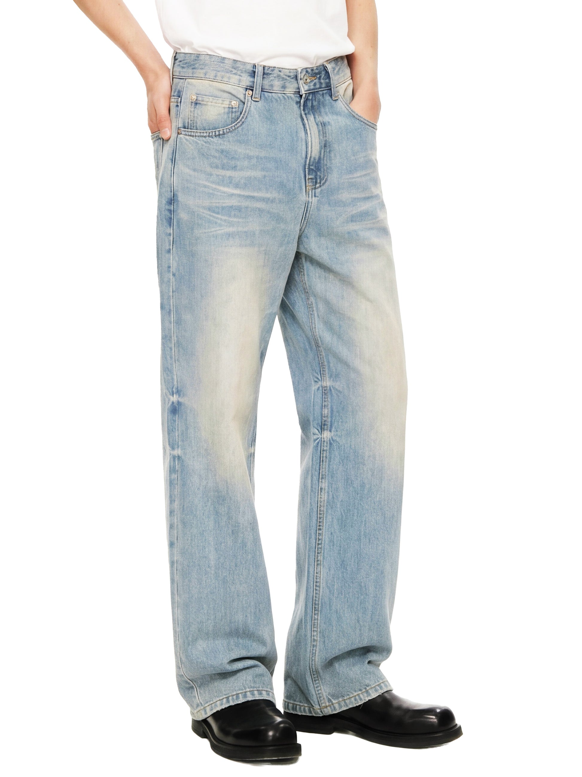 ODMPOD Sun Fade Raw Hem Denim Jeans showing distressed raw hems and faded sun-washed blue denim fabric.